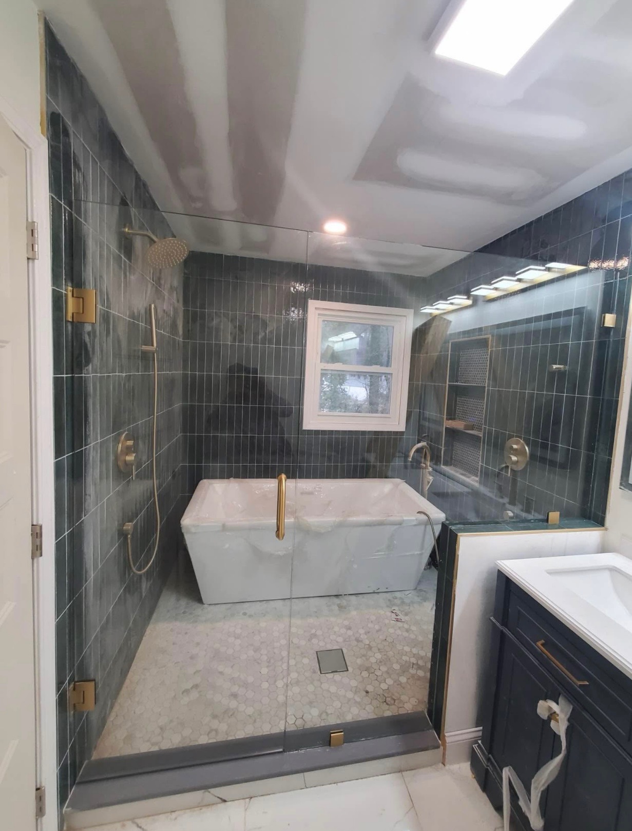 Slate tile shower with soaker tub
